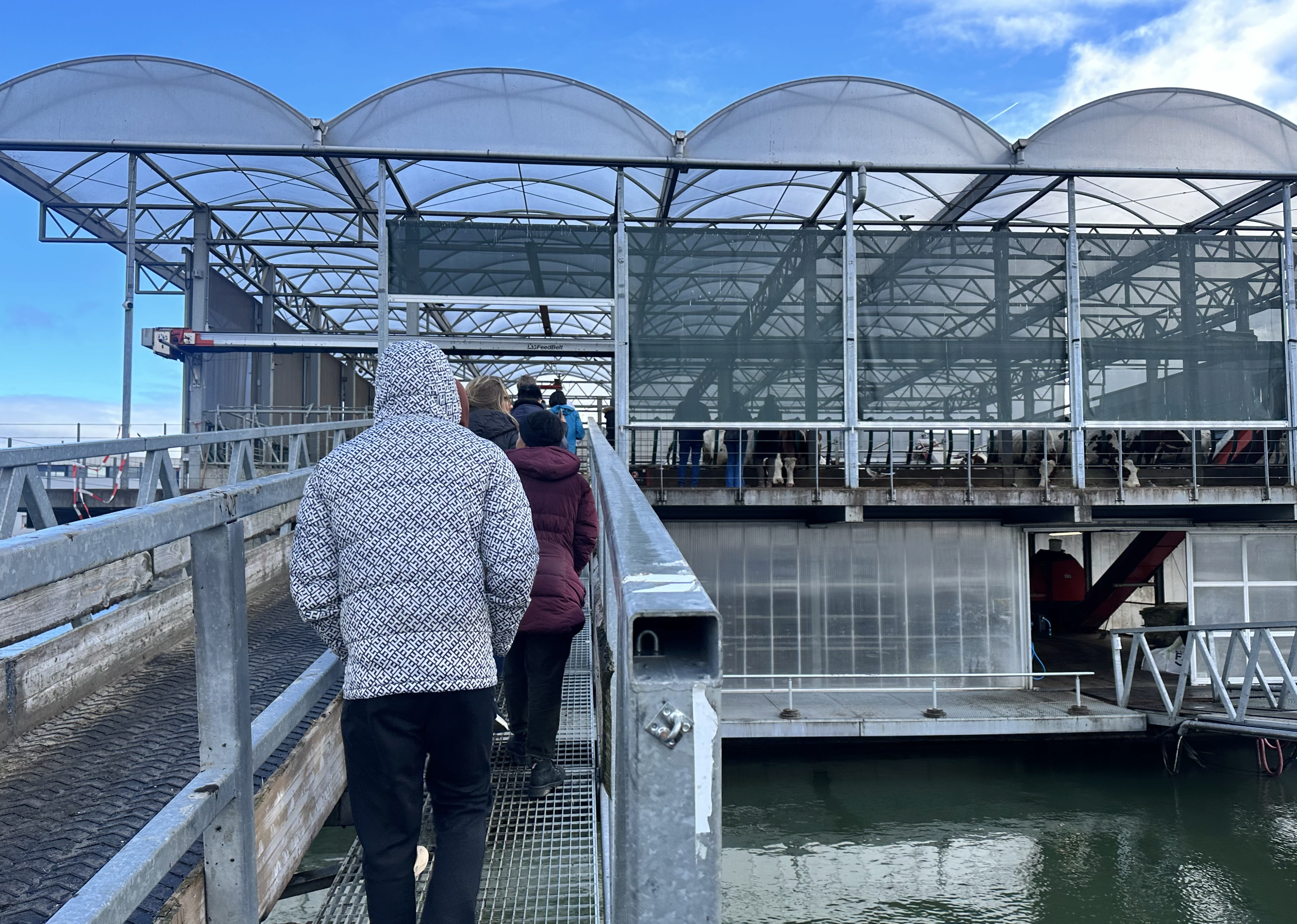 Floating Farm 2 Image of students in winter coats walking over a bridge to reach Rotterdam’s Floating Farm