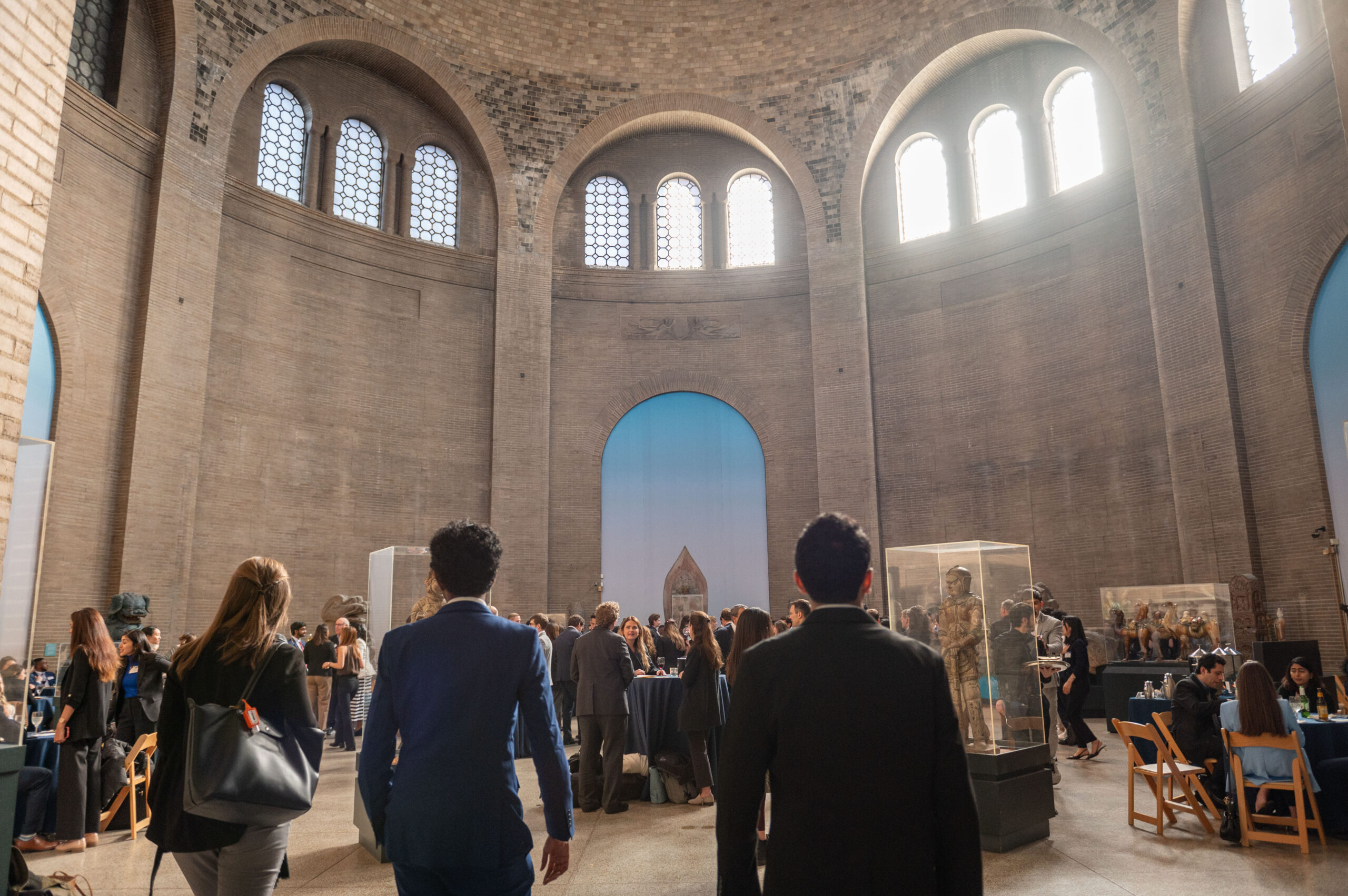 Wide shot of a cocktail reception in Penn Museum