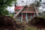 Downed trees on a home in the aftermath of Hurricane Helene, Sept. 29, 2024, in Rutherfordton, N.C.