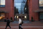 Facade of Huntsman Hall, with students passing in front of it in a blur.