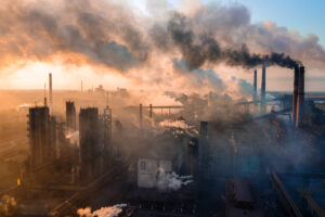 industry metallurgical plant releases smoke at dawn